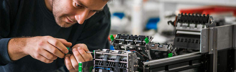 A Parts Repair Technician servicing a Wincor CCDM VN3 module